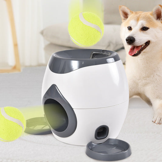 Smart pet feeder and tennis ball reward machine in white and lime green, with two mini tennis balls and a scoop.