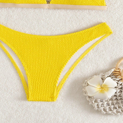 Bright yellow textured two-piece bikini with a triangle top and high-cut bottom, modeled on a person. - Image 4