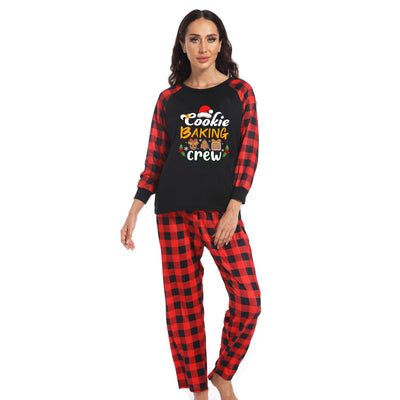 Baby black romper with red plaid sleeves and cuffs, featuring a "Cookie Baking Crew" graphic with Christmas icons. - Image 2
