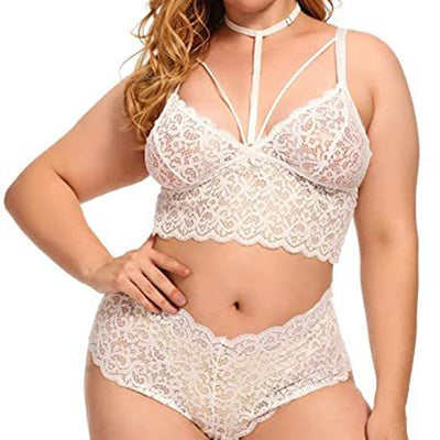 Plus size model wearing a red lace longline bralette with a choker and matching high-waisted briefs.