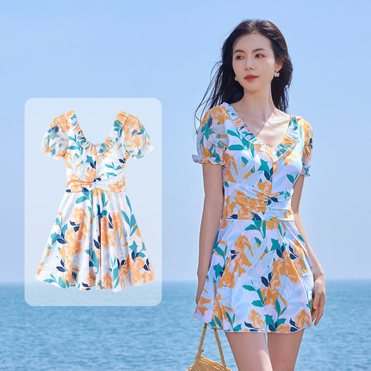 White floral high waist swimsuit dress with orange, teal, and navy flowers, ruffled scoop neck, and puff sleeves. - Image 4