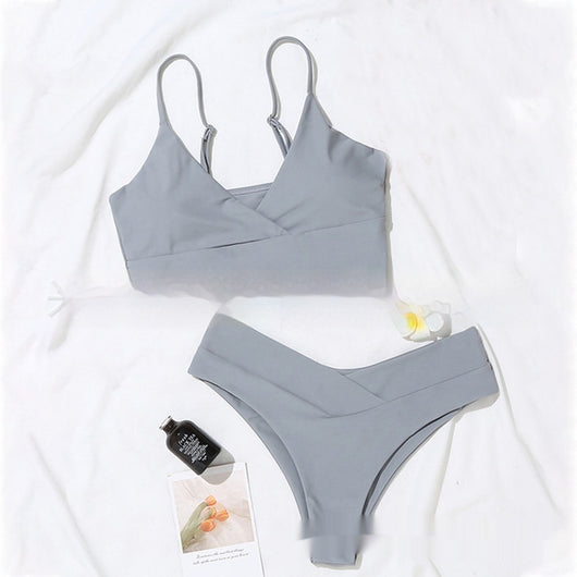 Bright yellow two-piece bikini swimsuit with a crop top and high-cut V-front bottoms, laid flat. - Image 13