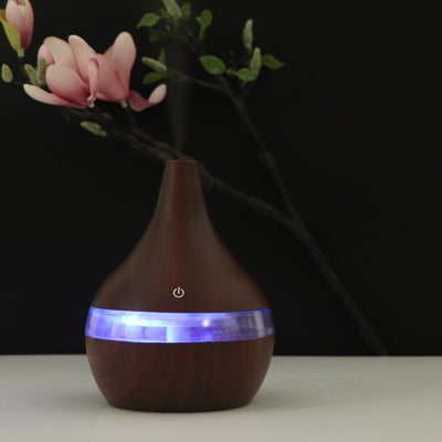 Dark wood grain USB mini tip air purifier and humidifier with a teardrop shape and a silver band. - Image 15
