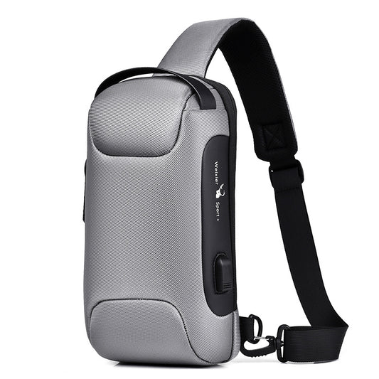 Light grey men's sling bag with a textured canvas finish, single padded shoulder strap, and visible USB charging port.