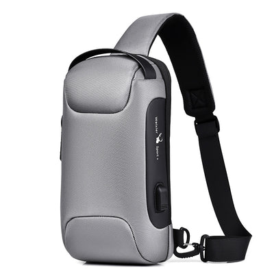 Light grey men's sling bag with a textured canvas finish, single padded shoulder strap, and visible USB charging port.