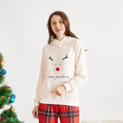 Family of four wearing matching cream fleece reindeer pajamas with red plaid pants, posing for a Christmas photo. - Image 5