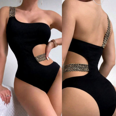 Black one-shoulder one-piece swimsuit with side cut-outs and gold chain-link detailing on strap and waist. - Image 18