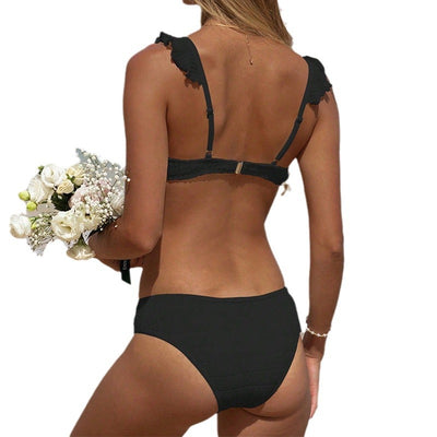 Green ruffled bikini with textured fabric and triangle top, modeled on a sunny beach. - Image 5
