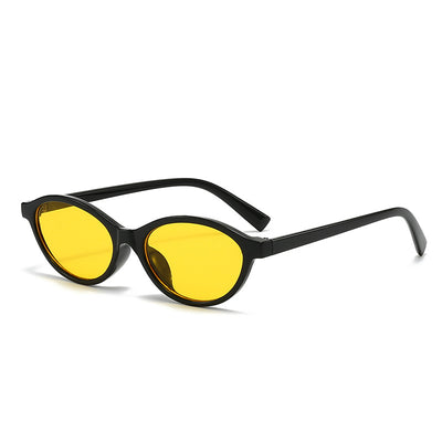 Retro fashion small frame sunglasses with translucent brown frames and yellow oval lenses, viewed from an angle. - Image 8