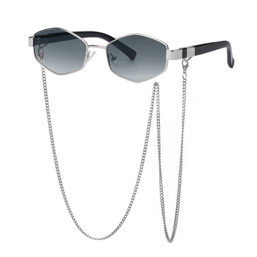 Women's hexagonal sunglasses with dark lenses, gold-colored metal frame, black temples, and a detachable gold chain. - Image 3