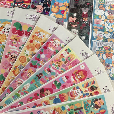 Korean style cartoon animal angel stickers with clouds and architectural elements on a blue sheet.