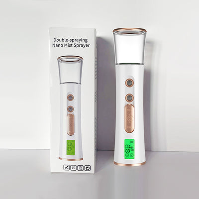 White and rose gold double-spraying nano mist sprayer with a clear reservoir, next to its product box and USB cable. - Image 10