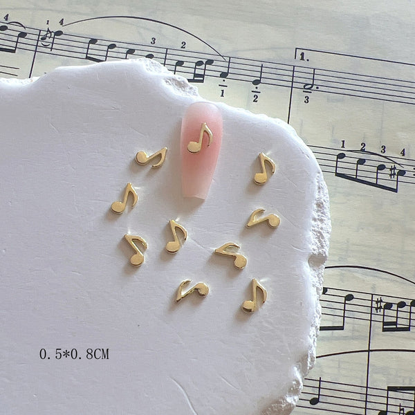 Accesorios de Uñas Metálicos con Símbolos Musicales