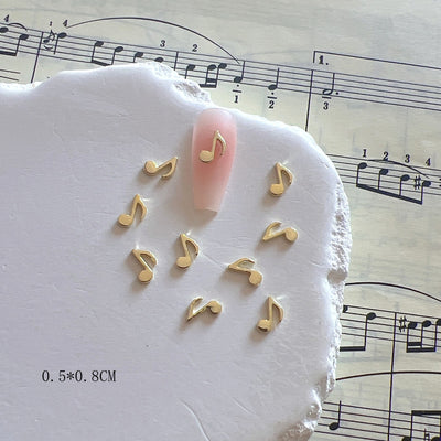 Accesorios de Uñas Metálicos con Símbolos Musicales