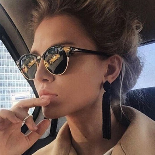 Retro clubmaster sunglasses with black frames, dark lenses, and gold-tone metal accents, shown from multiple angles.