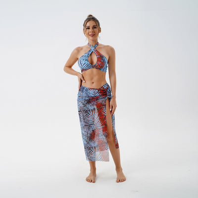 Women's plus size split swimsuit with a blue and green tropical leaf print halter bikini top and matching sarong skirt. - Image 39
