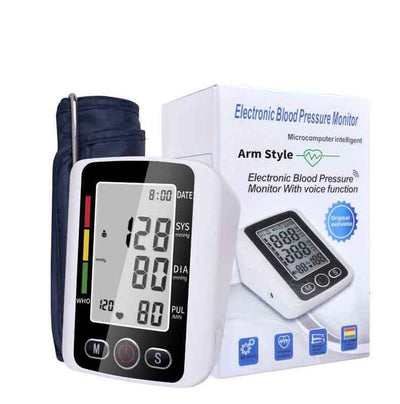 White electronic arm blood pressure monitor with large digital display and dark blue cuff, next to its product box. - Image 8