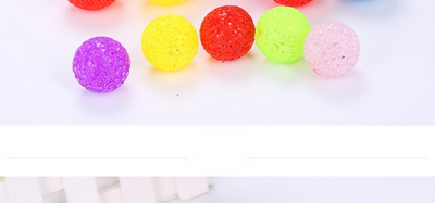 Assortment of colorful textured plastic cat toy balls in red, yellow, blue, purple, pink, and green. - Image 6