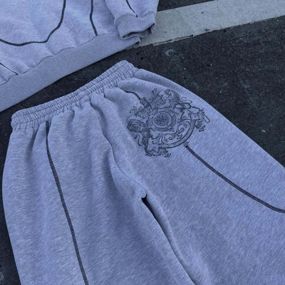 Light gray hooded tracksuit with dark gray contrast stitching, featuring a full-zip hoodie and matching loose sweatpants. - Image 16