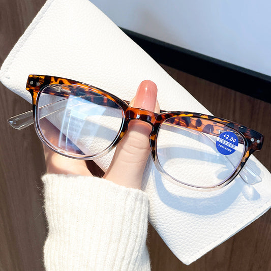 Women's retro leopard print presbyopic glasses with anti-blue light clear lenses and a blue gradient bottom frame. - Image 2