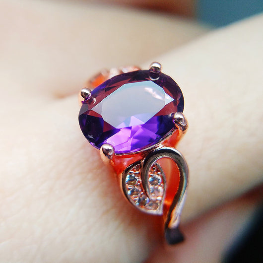 Rose gold necklace with a teardrop purple gemstone pendant and matching dangle earrings. - Image 24