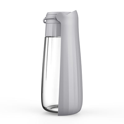 Yellow 450ml portable pet water bottle with a folding drinking trough and white wrist strap, on grass. - Image 5