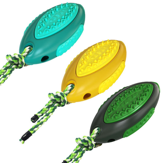 Yellow dog toy with textured surface and braided rope handle, held by a light-colored dog. - Image 7