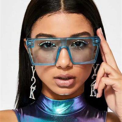 Oversized flat-top sunglasses with translucent red plastic frames and matching red lenses on a white background. - Image 19