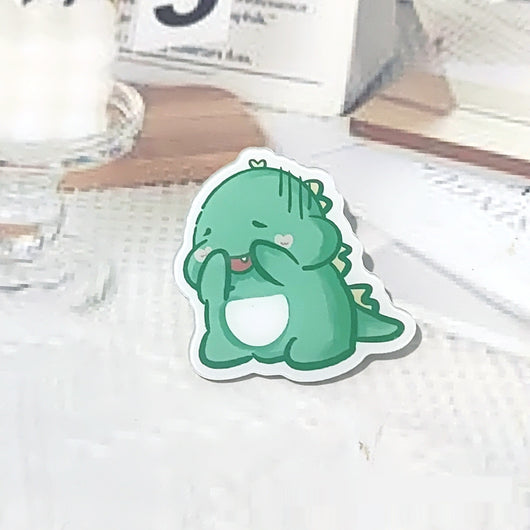Cute green cartoon dinosaur acrylic badge brooch with a shy expression and small spikes on its back. - Image 9