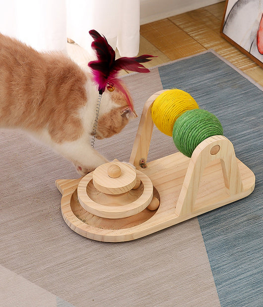 Solid wood cat toy with a tiered ball track, a spring-loaded feather wand, and green and yellow sisal rollers. - Image 11