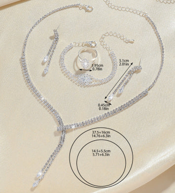 Sparkling rhinestone necklace, dangle earrings, and bracelet set on a black display, perfect for formal events. - Image 12