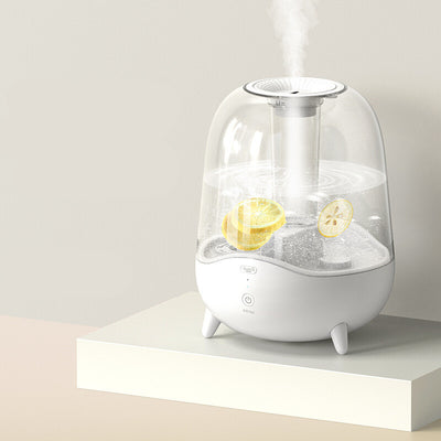 White and clear household silent air humidifier emitting mist, with lemon slices visible in the transparent water tank. - Image 6