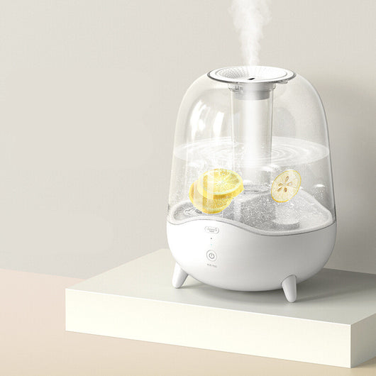 White and clear household silent air humidifier emitting mist, with lemon slices visible in the transparent water tank. - Image 6