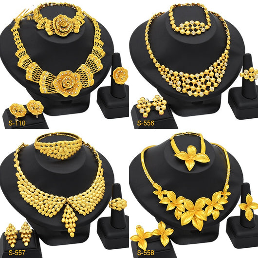 Women's four-piece gold-tone jewelry set with floral designs, including a necklace, bracelet, ring, and earrings. - Image 4