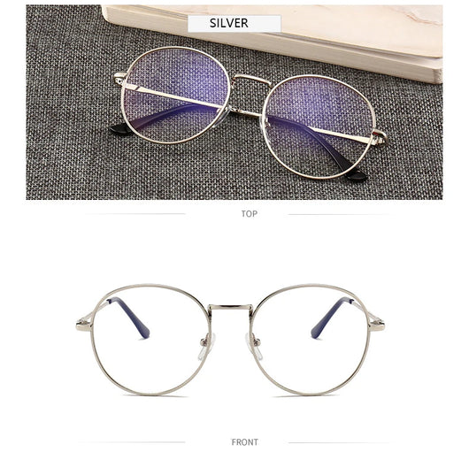 Black round anti-blue light glasses with clear lenses showing a blue reflection, resting on a gray textured surface. - Image 11