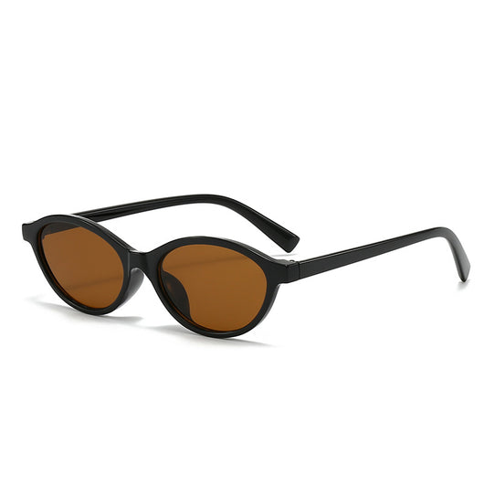 Retro fashion small frame sunglasses with translucent brown frames and yellow oval lenses, viewed from an angle. - Image 2