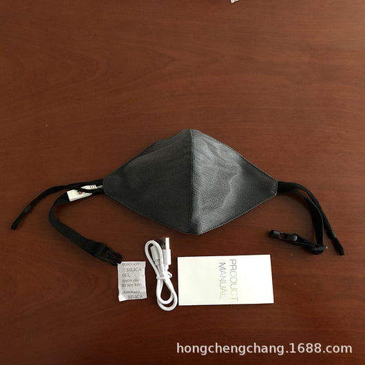 White LED mask with adjustable ear loops, a USB charging cable, and an instruction manual on a wooden surface. - Image 6