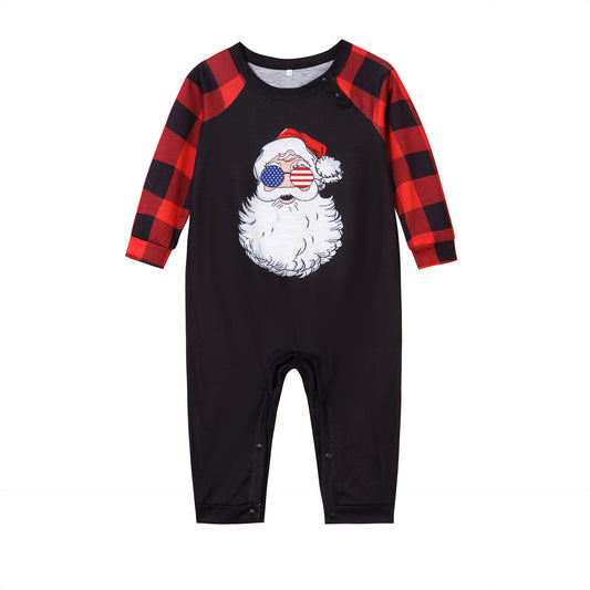 Christmas pajama set with a black long-sleeve top featuring a Santa head in American flag sunglasses and red and black buffalo plaid pants. - Image 2