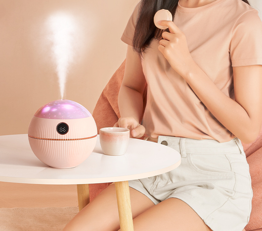Pink spherical humidifier with a white top, ribbed texture, rose gold band, and a digital display showing 73%. - Image 6