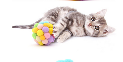 Colorful cat toy ball made of soft, pastel-colored pom-poms, including yellow, pink, purple, green, and blue. - Image 6