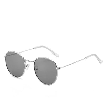 Round gold-framed sunglasses with pink tinted lenses, featuring clear temple tips. - Image 13