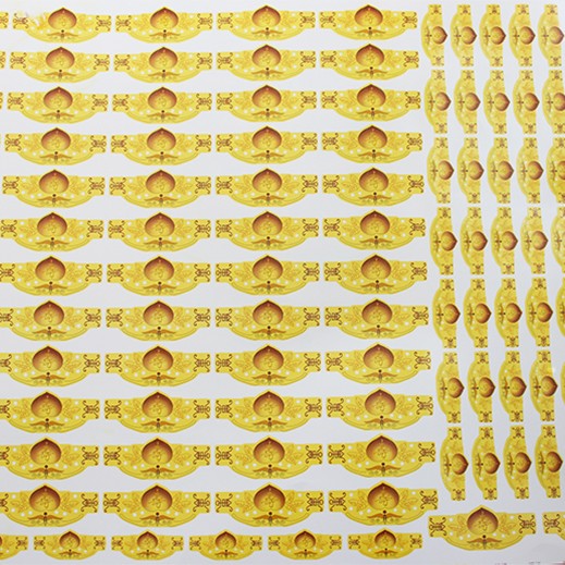 Sheet of gold ceramic decals with ornate, symmetrical designs, ideal for pottery and craft decoration.