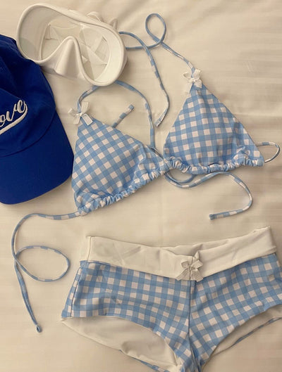 Light blue and white gingham bikini set with a triangle halter top and low-rise boy short bottoms with a small bow. - Image 16