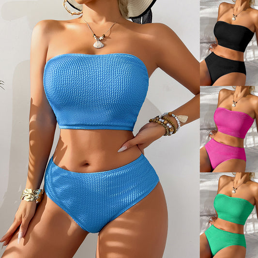 Blue high-waisted bikini set with a textured bandeau top and high-cut bottoms, laid flat on white.
