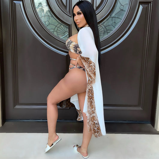 Woman in a three-piece snake print bikini with a halter top, wrap-around straps, and a sheer white shawl. - Image 3