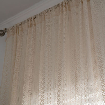 Translucent off-white American Country hollow crochet curtain with intricate patterns and tassel trim, draped by a window. - Image 10