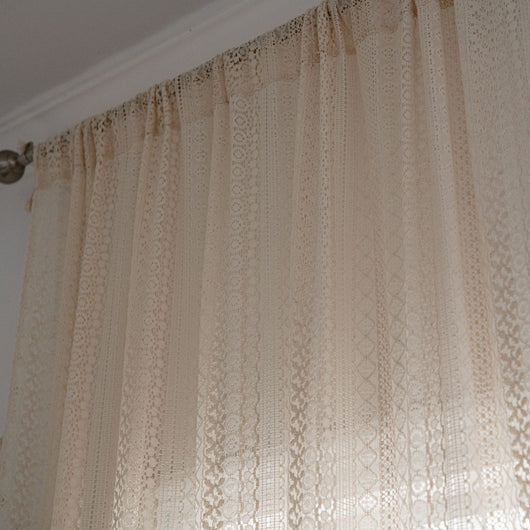 Translucent off-white American Country hollow crochet curtain with intricate patterns and tassel trim, draped by a window. - Image 10