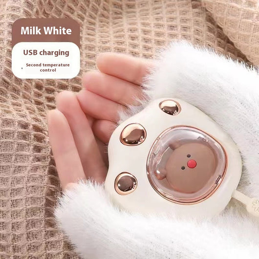 Dark green paw-shaped hand warmer and power bank with a cute bear design, held in a hand with white faux fur gloves. - Image 9