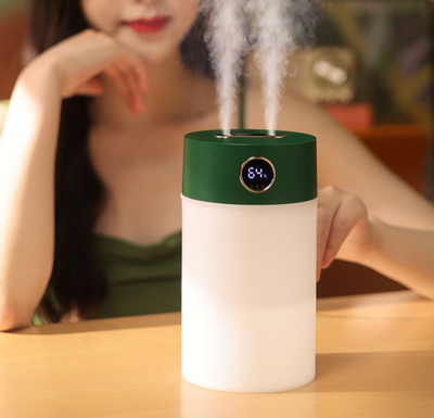 White cylindrical humidifier with a gold nozzle emitting mist, featuring a subtle bear emblem. Includes five aromatherapy oil bottles. - Image 18