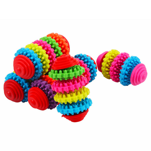 A hand holds a colorful rubber dog toy ball with seven interlocking gear-like rings in purple, orange, green, red, yellow, pink, and blue. - Image 10